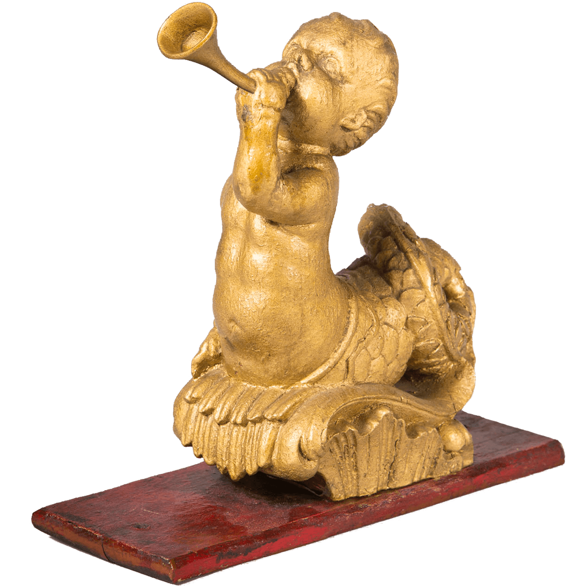 Gouden beeldje van een engeltje die op een Arreslede stond.